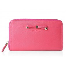 Portafoglio Prada Saffiano Zippy con fiocco rosa acceso